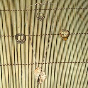 Silver Angel Wing Pendant Necklace and set of  3 rings .